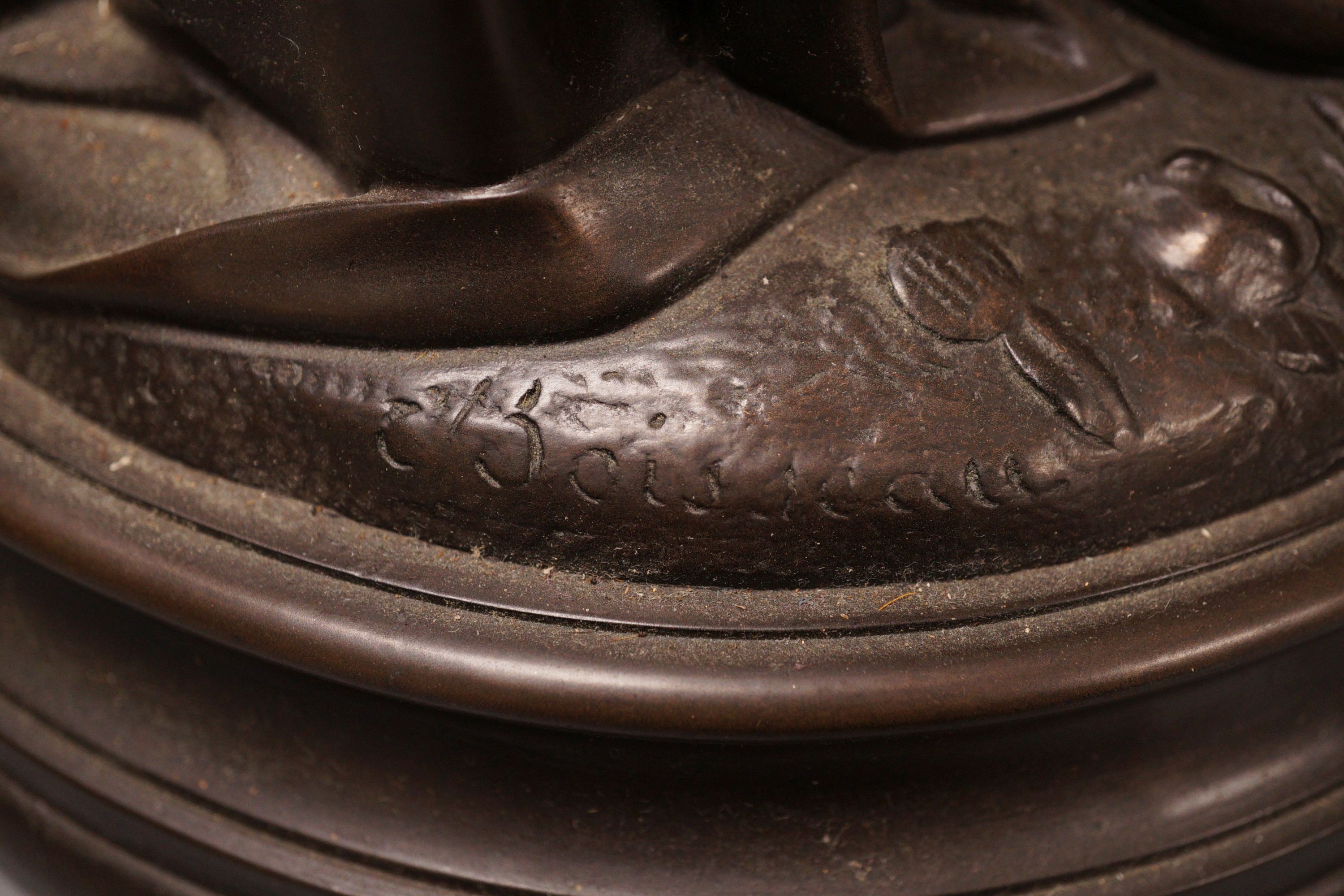 After Boisseau, a tall bronzed metal figure of a standing maiden, signed to verso, 58cm tall